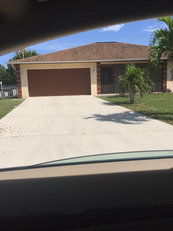 Property Photo: 702 SW Amber FL 34953