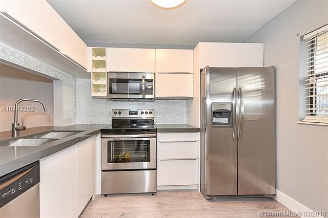 Property Photo:  129 NW 93rd Ave 129  FL 33024 
