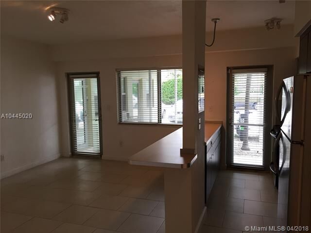 Property Photo:  6835 Rue Versailles 104  FL 33141 