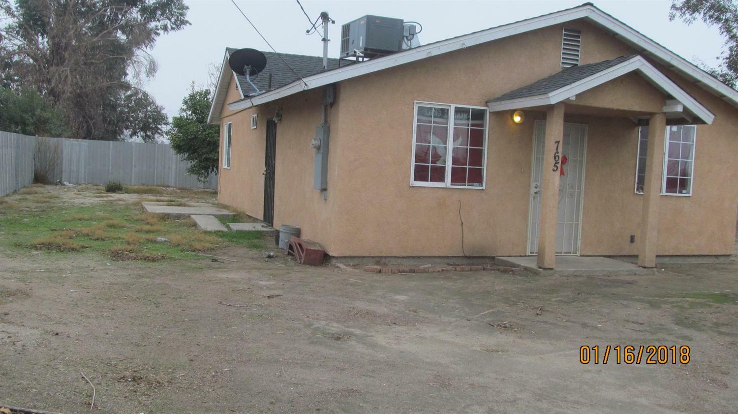 Property Photo:  765 W Poplar Avenue  CA 93257 