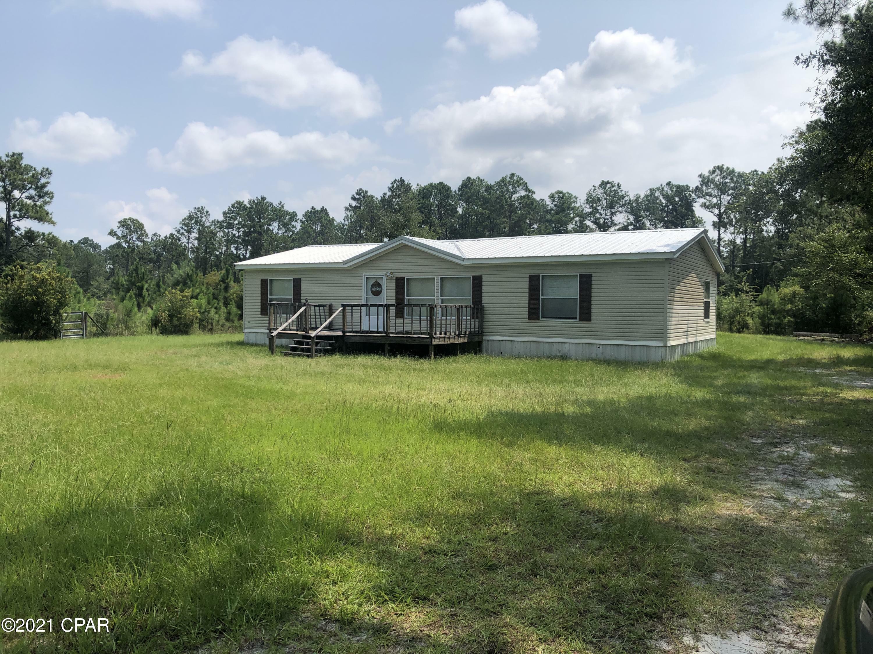 Property Photo: 11604 Highway 77 FL 32409