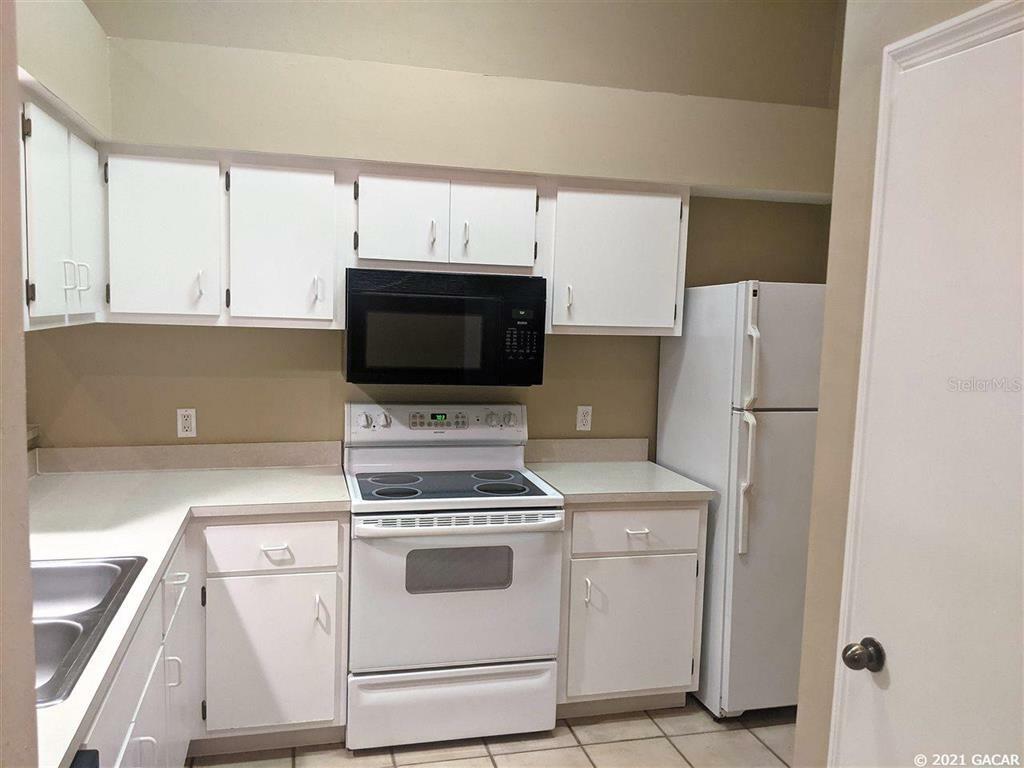 Property Photo:  4700 SW Archer T136  FL 32608 