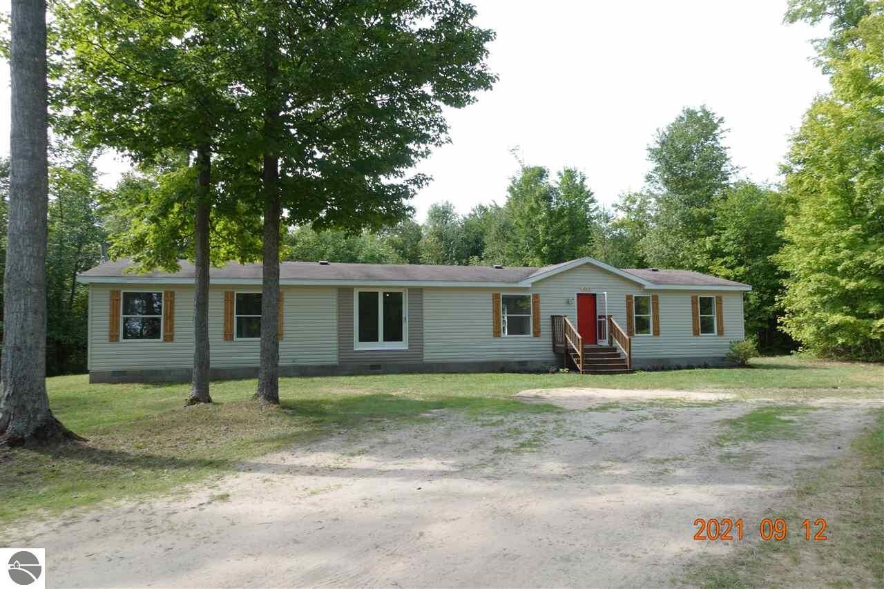 Property Photo:  8819 N 8 Mile Road  MI 49651 