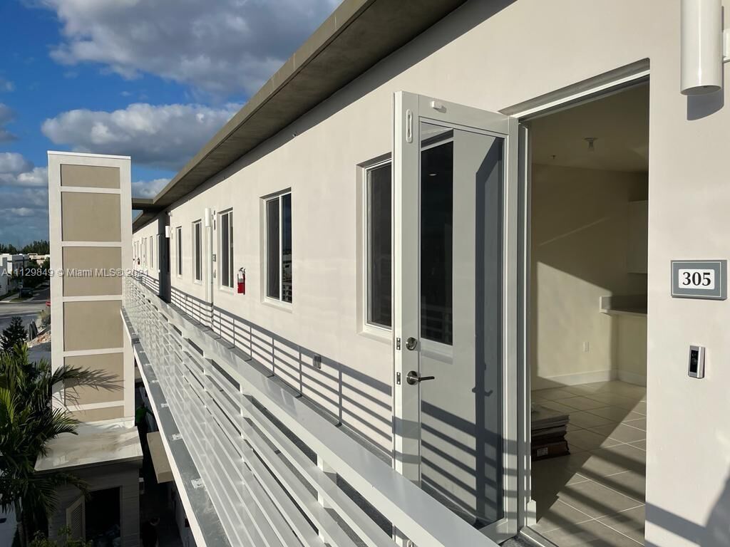 Property Photo:  6453 NW 102 Path 305  FL 33178 