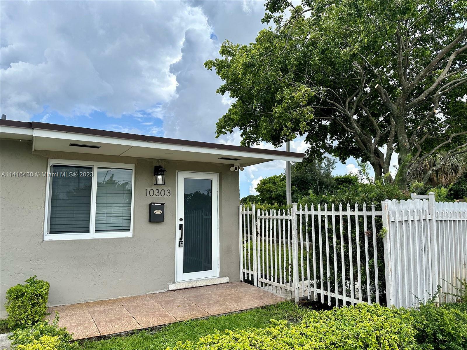 Property Photo: 10303 NW 35th Pl 10303 FL 33147