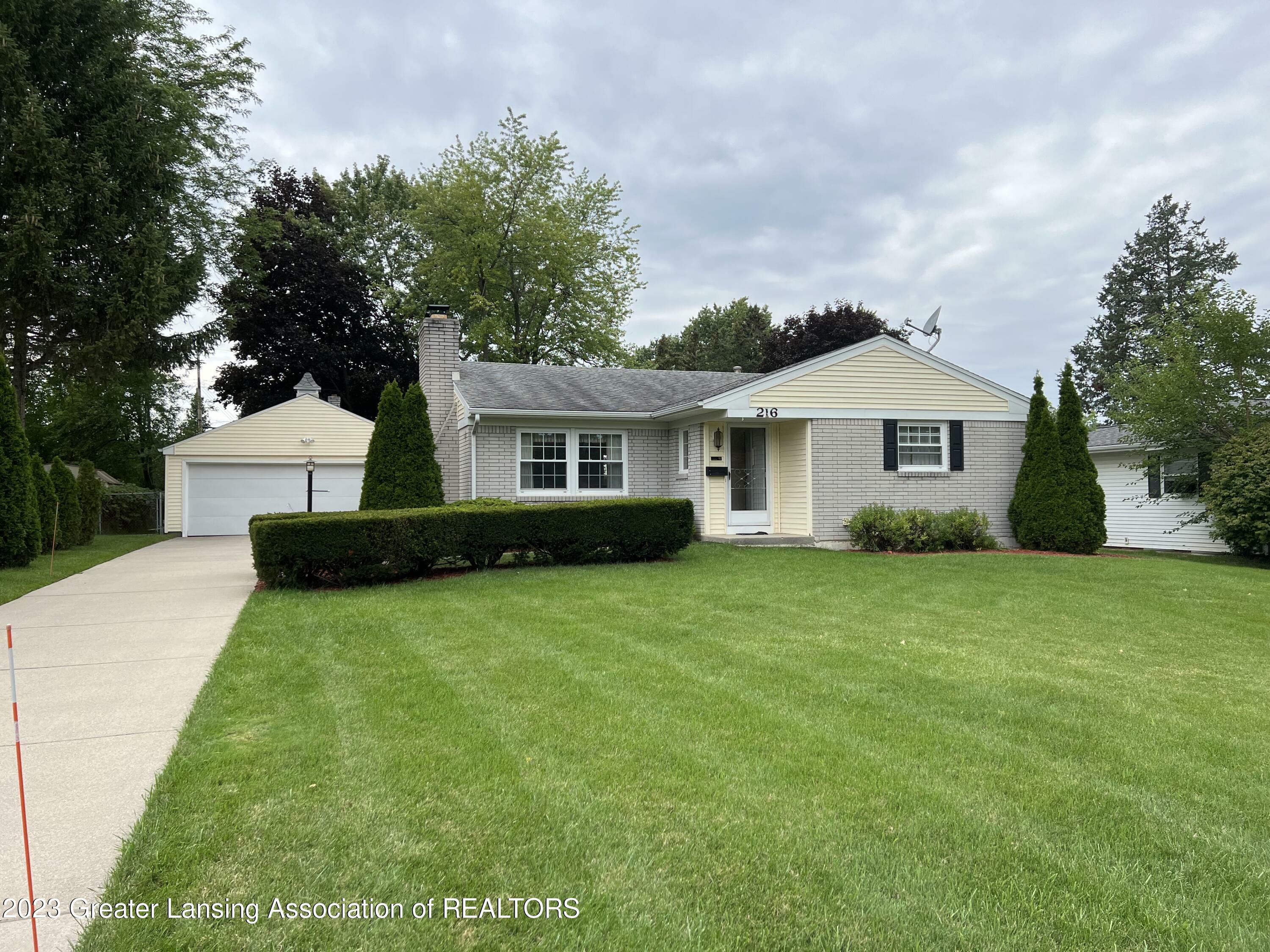 Property Photo:  216 Woodhaven Drive  MI 48917 