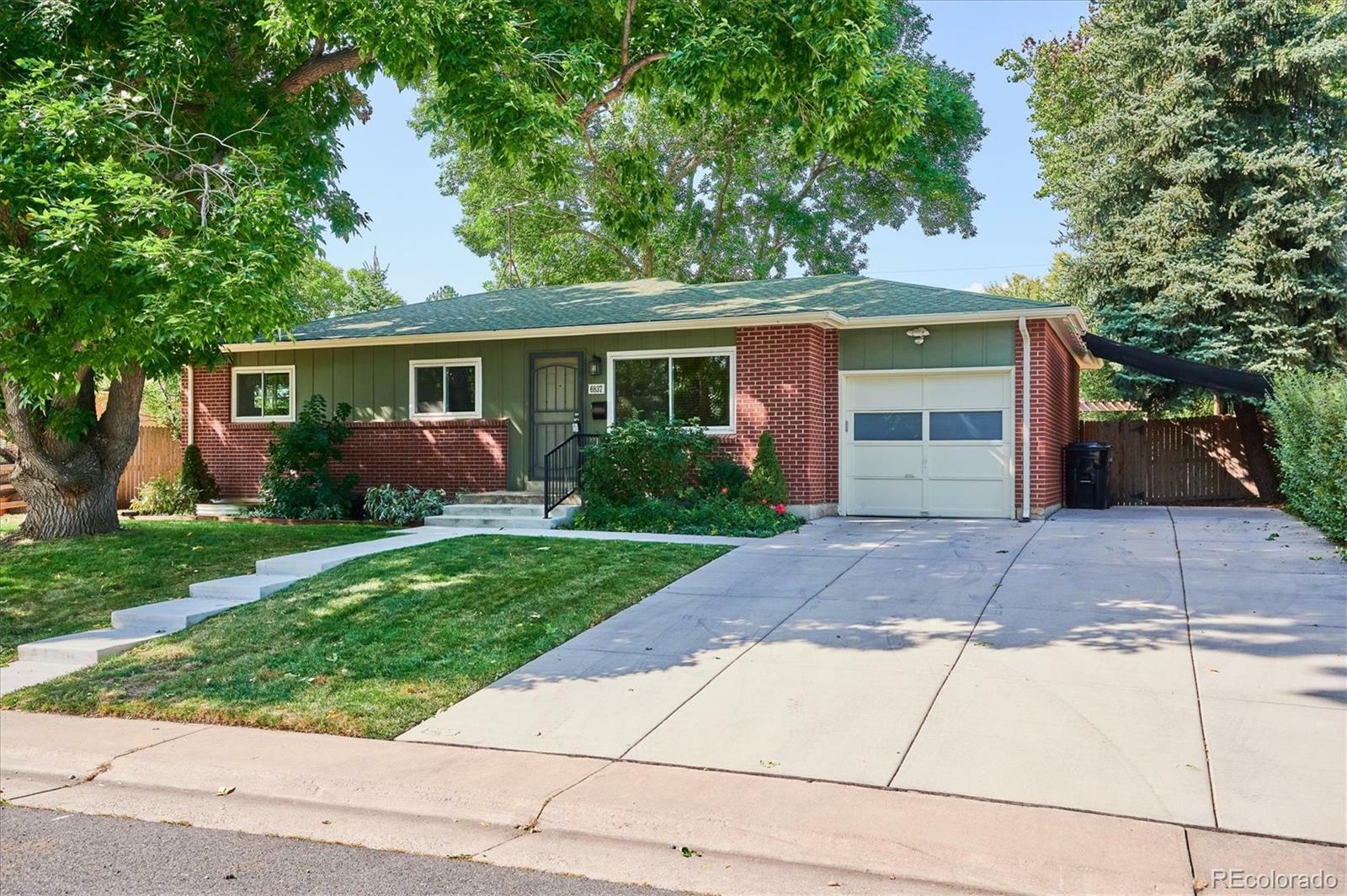 Property Photo:  6837 Newcombe Street  CO 80004 