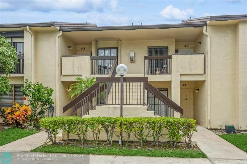 Property Photo:  1937 SW 15th St 52  FL 33442 