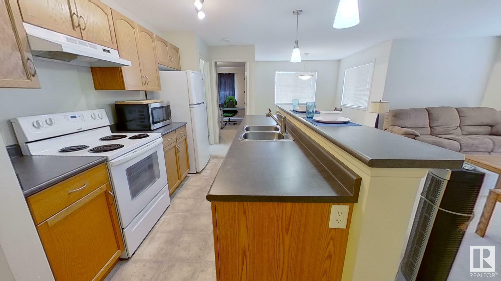 Property Photo:  1188 Hyndman Road NW 416  AB T5A 0E9 