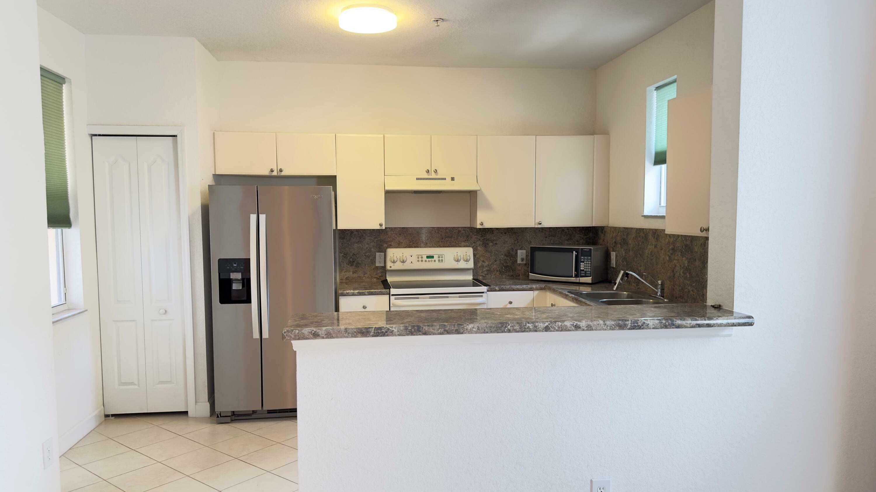 Property Photo:  1124 Shoma Drive 1124  FL 33414 