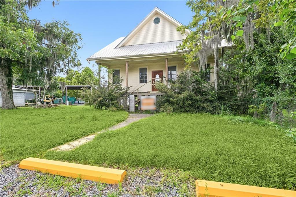 Property Photo:  406 Covington Street  LA 70447 