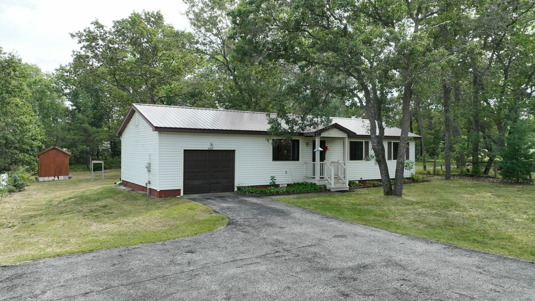 Property Photo:  7215 Tuscarora Circle  MI 49749 