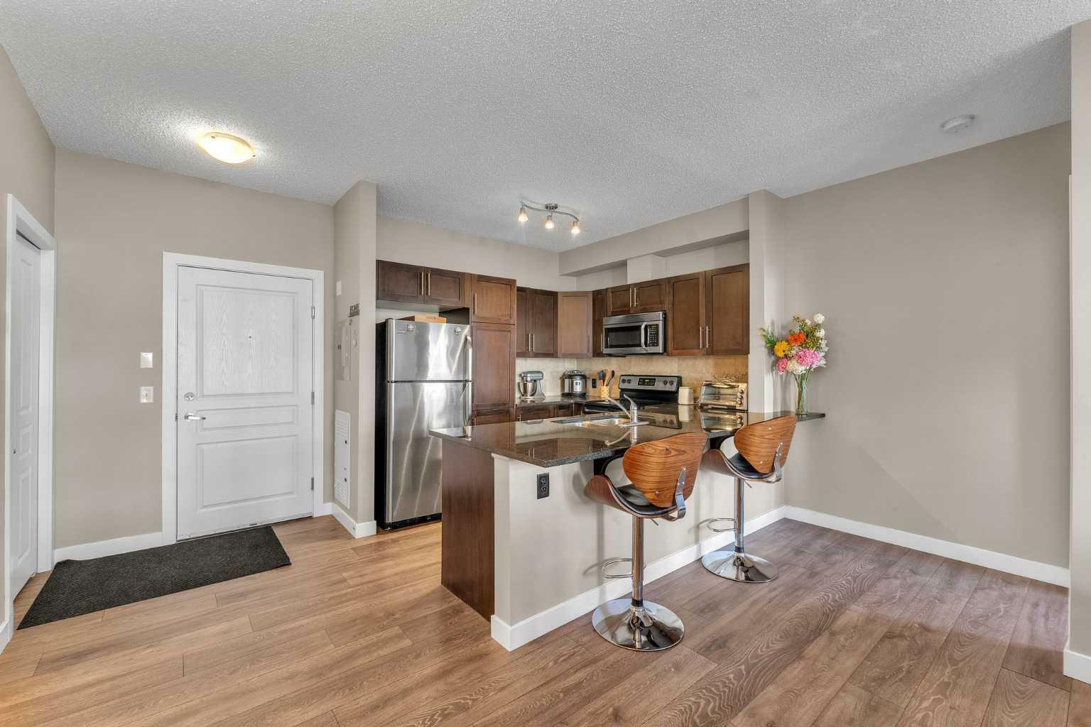 Property Photo:  76 Panatella Road NW 106  AB T3K 0V4 