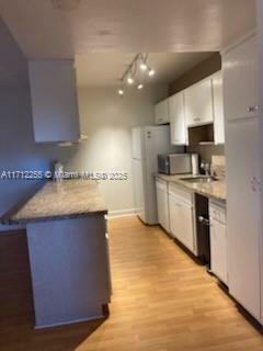 Property Photo:  1100 NE 9th Ave 305  FL 33304 