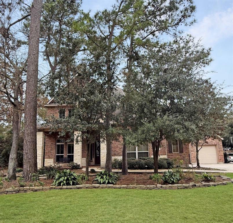 Property Photo:  99 Player Oaks Place  TX 77382 