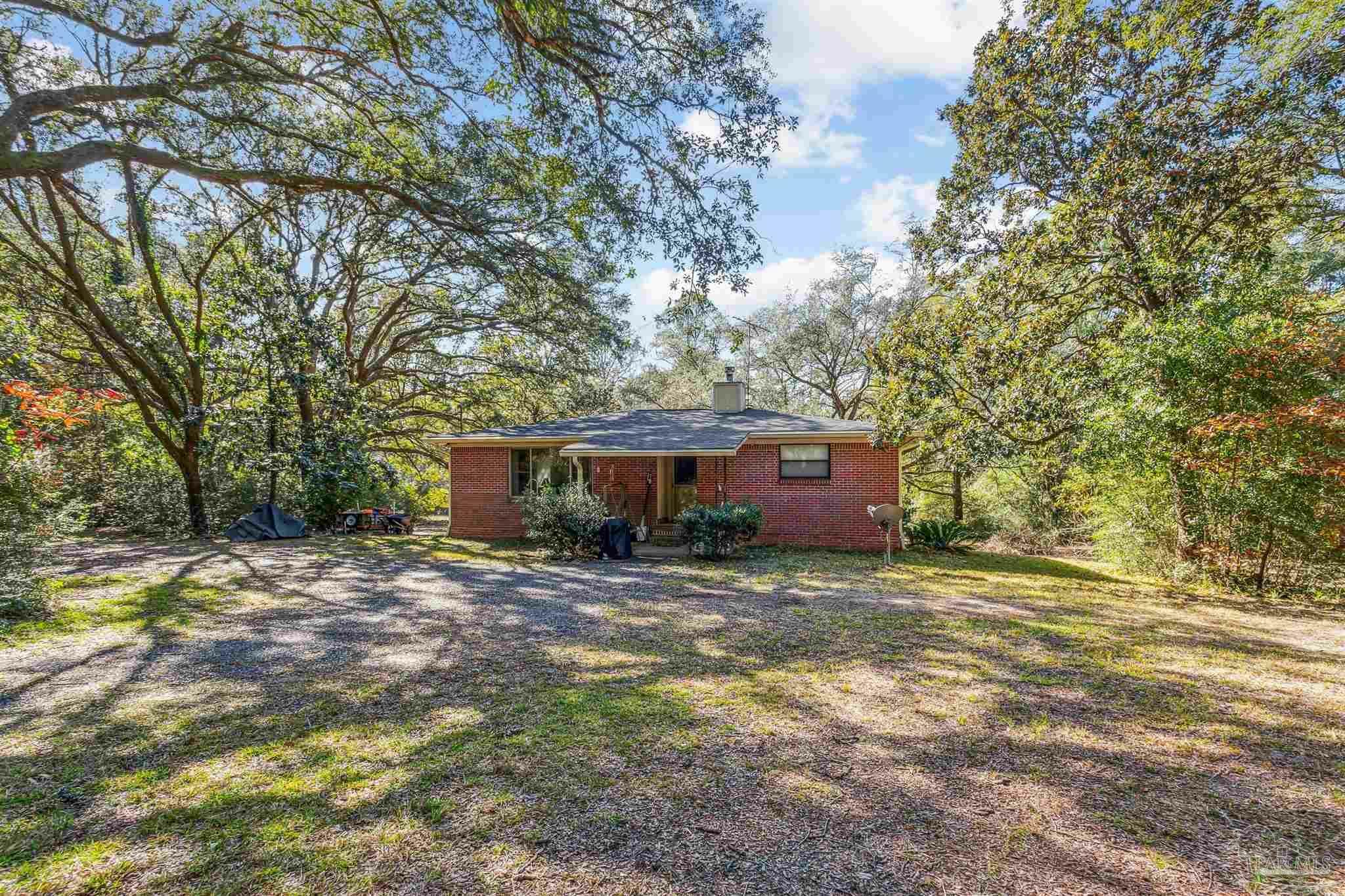 Property Photo:  7665 Lund Rd  FL 32570 