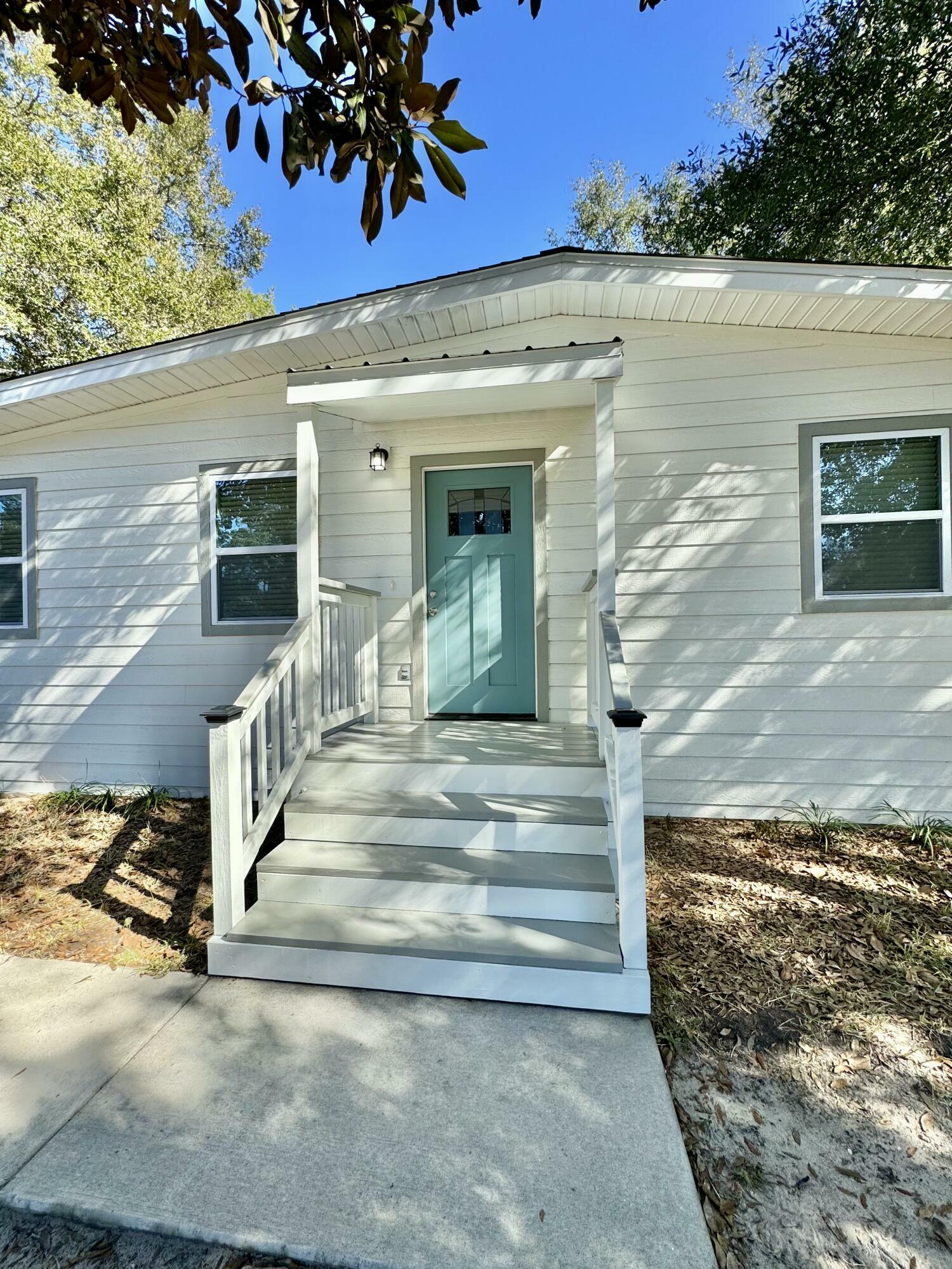 Property Photo:  115 NW Rainbow Drive  FL 32548 