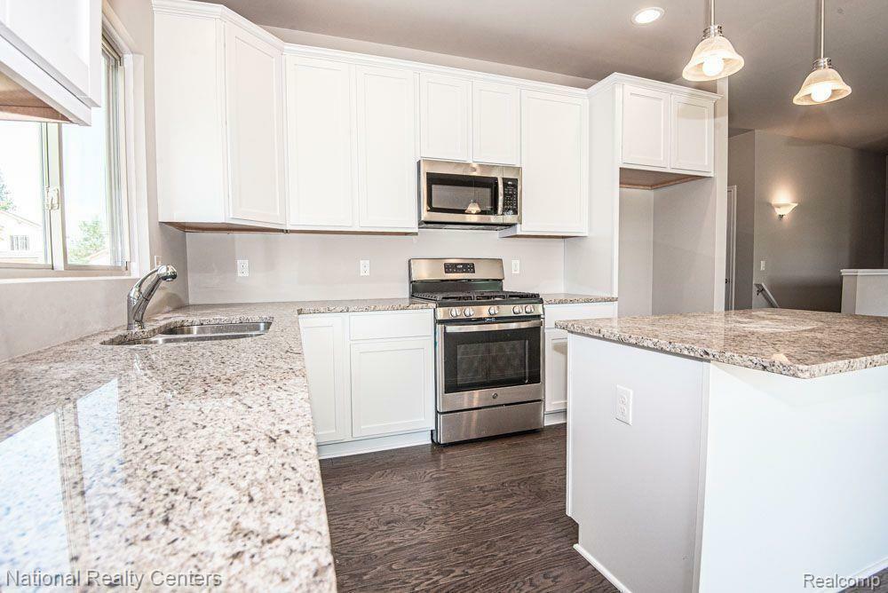 Property Photo: 303 Devonshire Drive MI 48446 4798