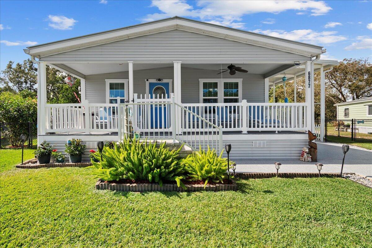 Property Photo: 6877 SE Delegate Street FL 33455