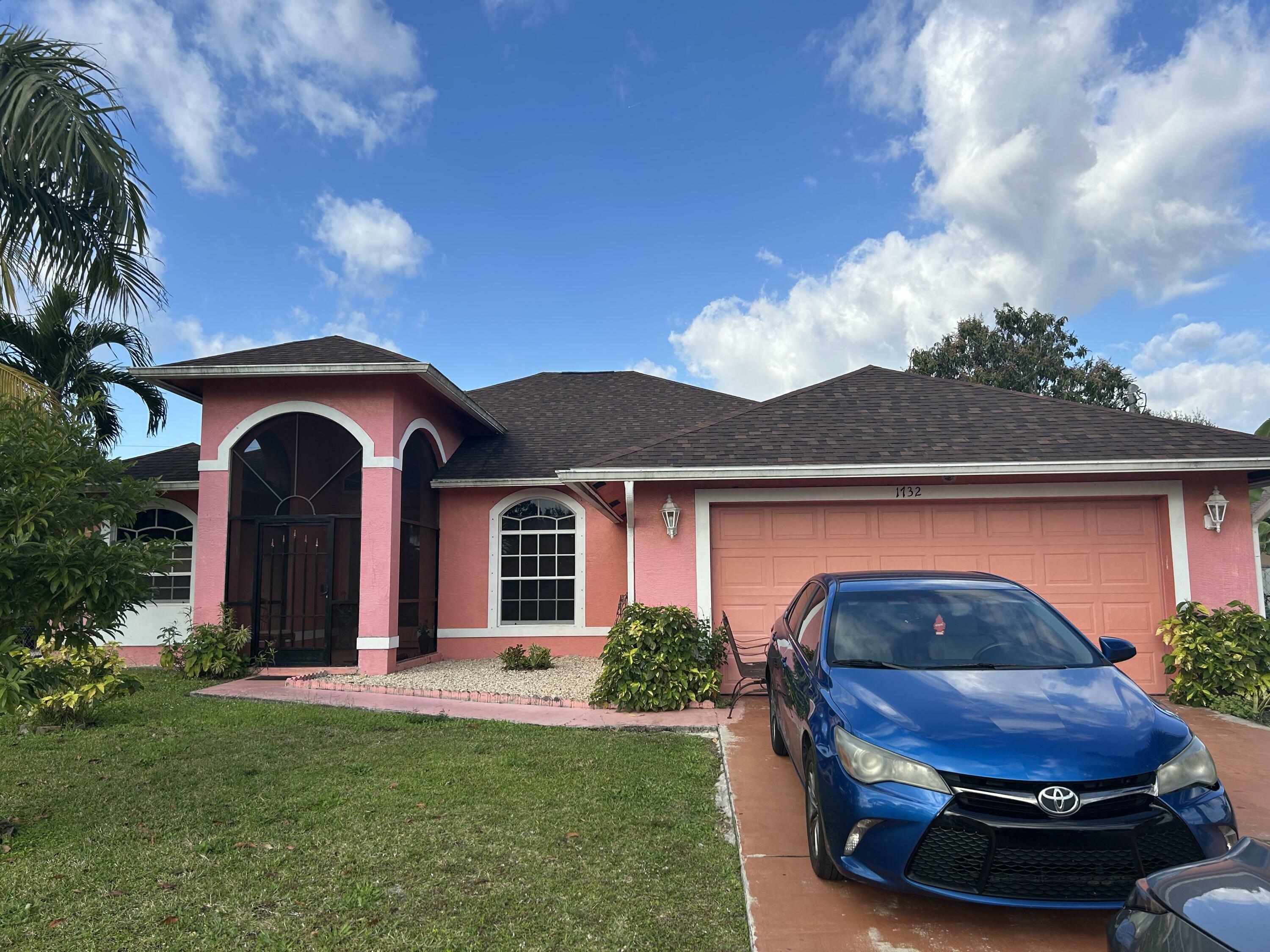 Property Photo: 1732 SW Alegre Street FL 34953