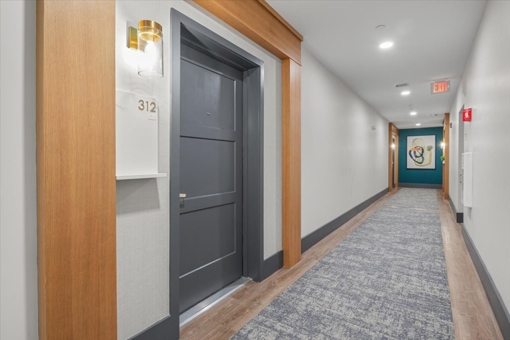 Property Photo: 50 Coppersmith Way 5-312 MA 02021