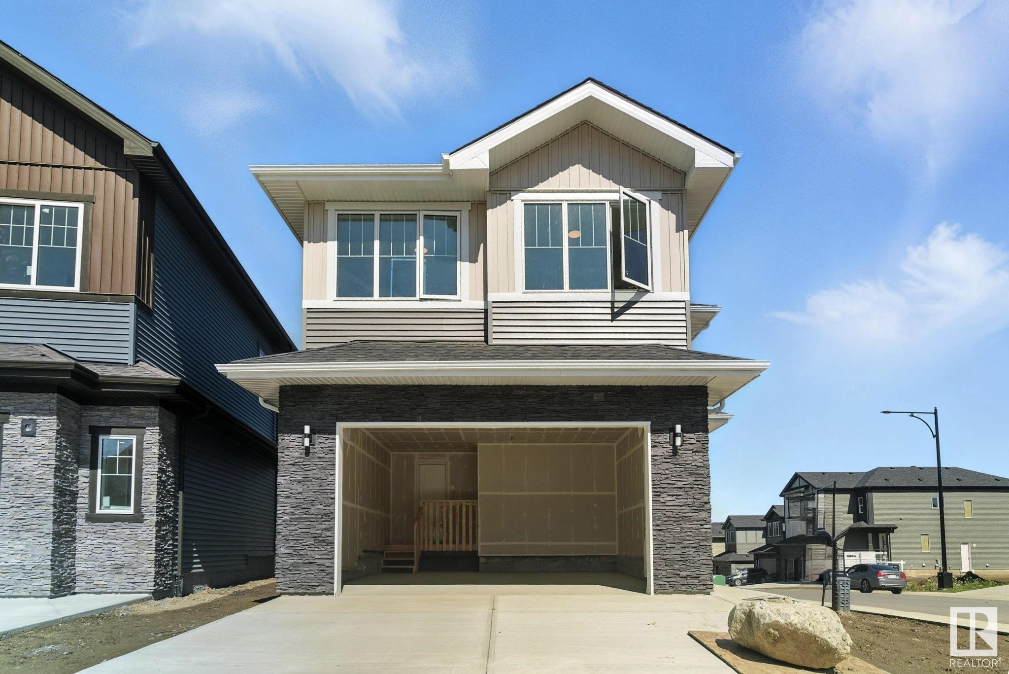 Property Photo:  1135 Gyrfalcon Crescent NW  AB T5S 0S5 