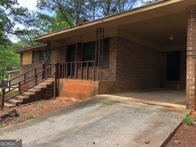Property Photo:  7225 Pineneedle Drive SW  GA 30014 