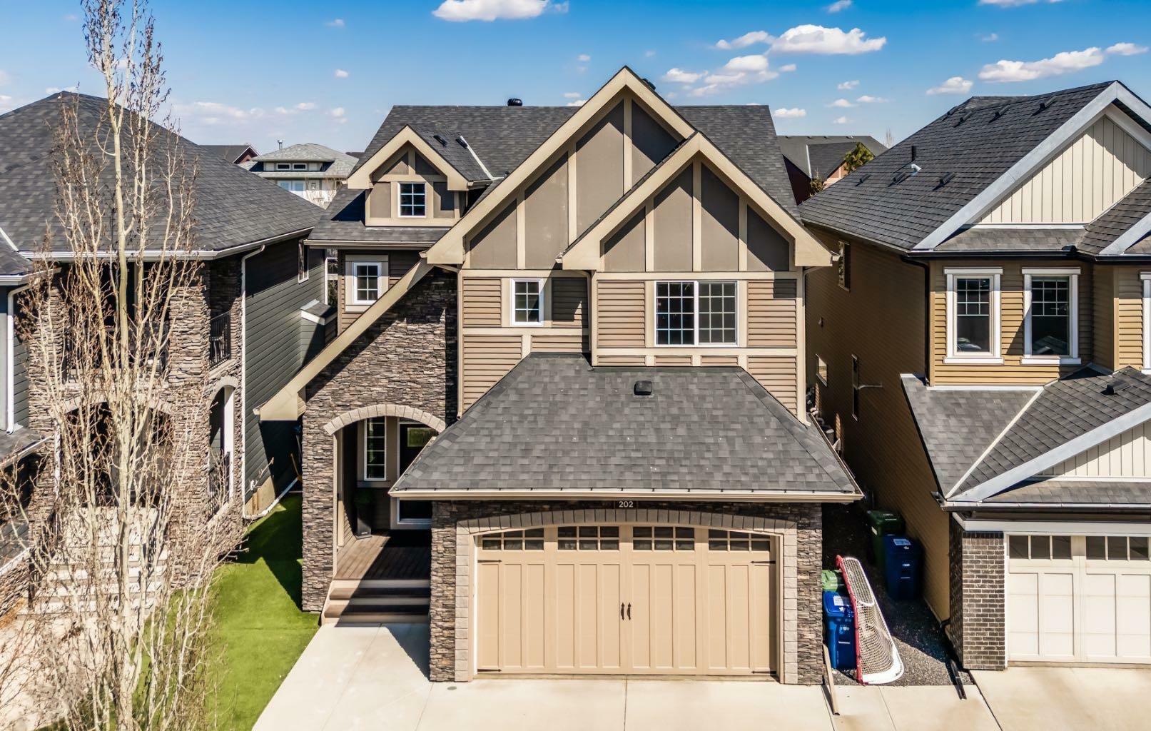 Property Photo: 202 Cooperstown Lane SW AB T4B 2L2
