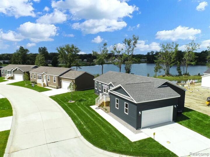 Property Photo:  202 Riviera Drive  MI 48446 