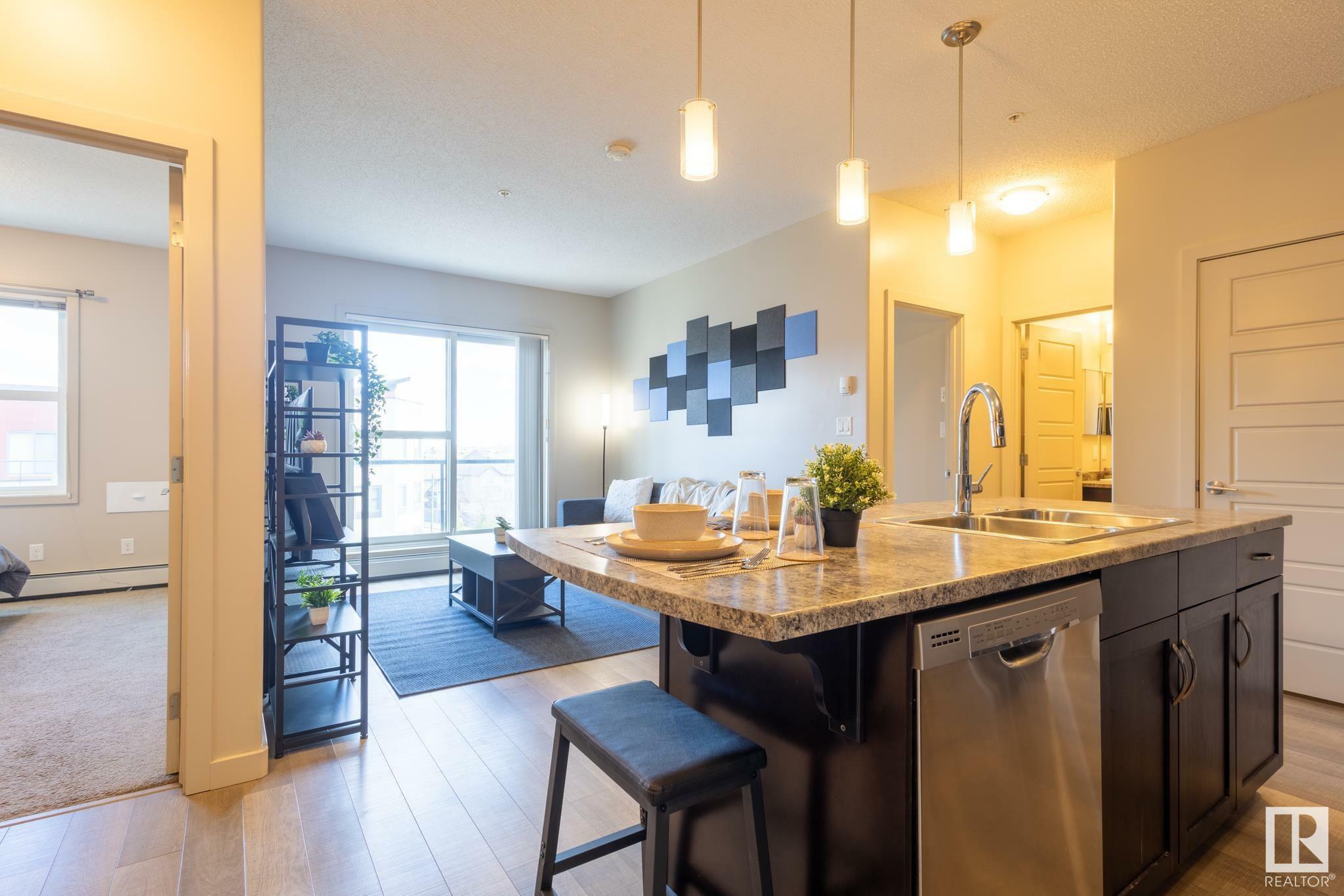 Property Photo:  320 Ambleside Link Link SW 403  AB T6W 2Z9 