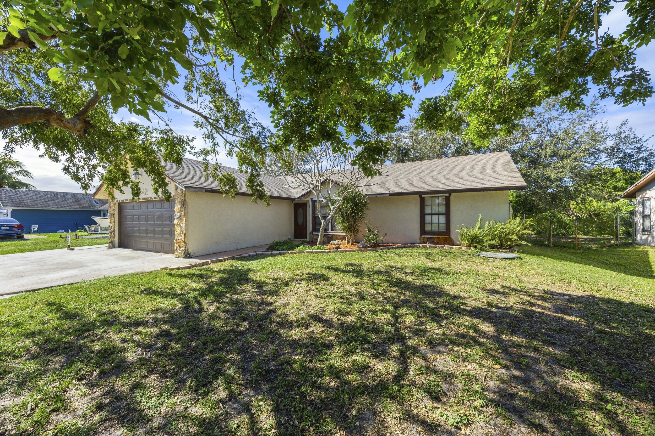 Property Photo: 2442 SW Lafayette Street FL 34984