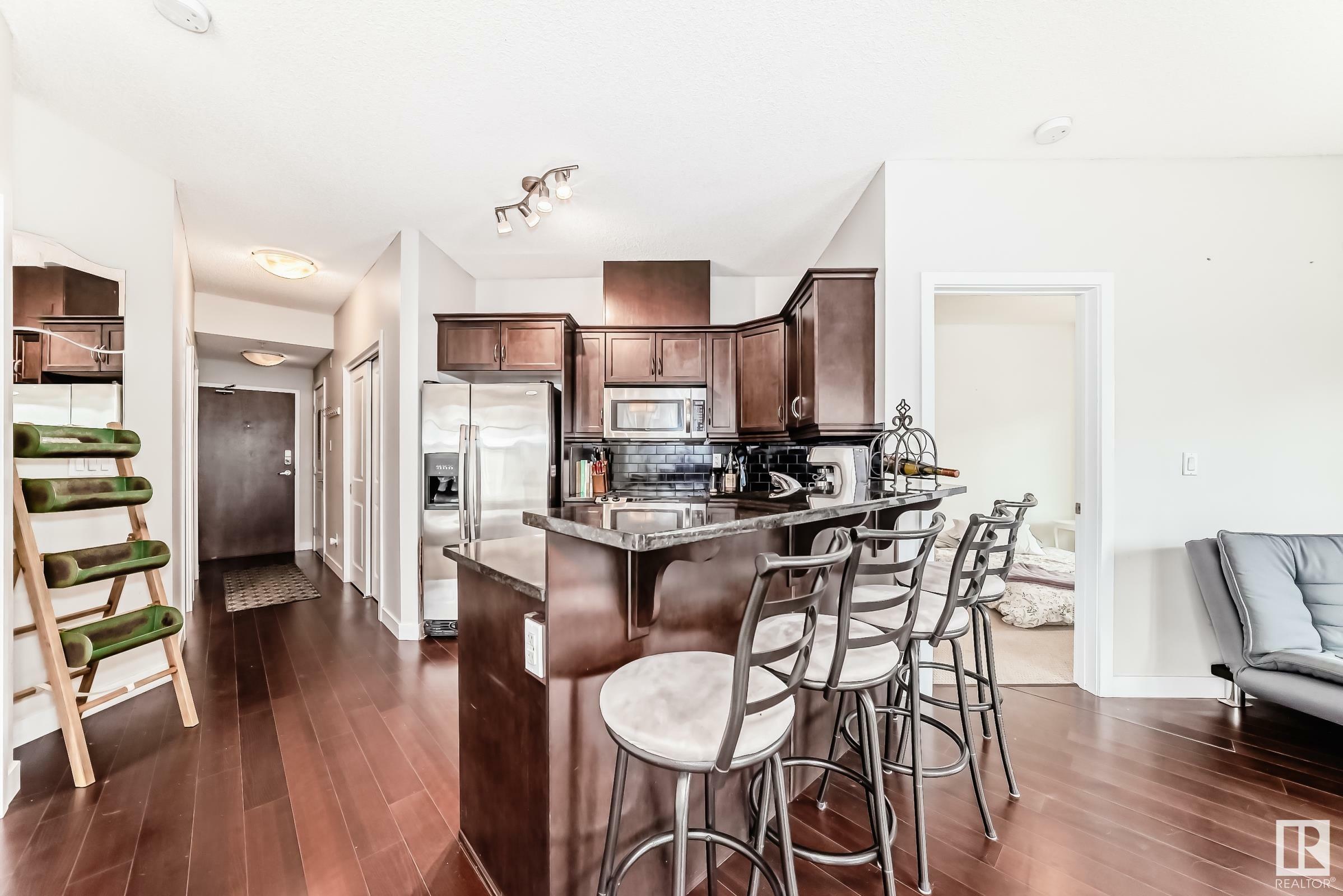 Property Photo: 7907 109 Street NW 102 AB T6G 1C7