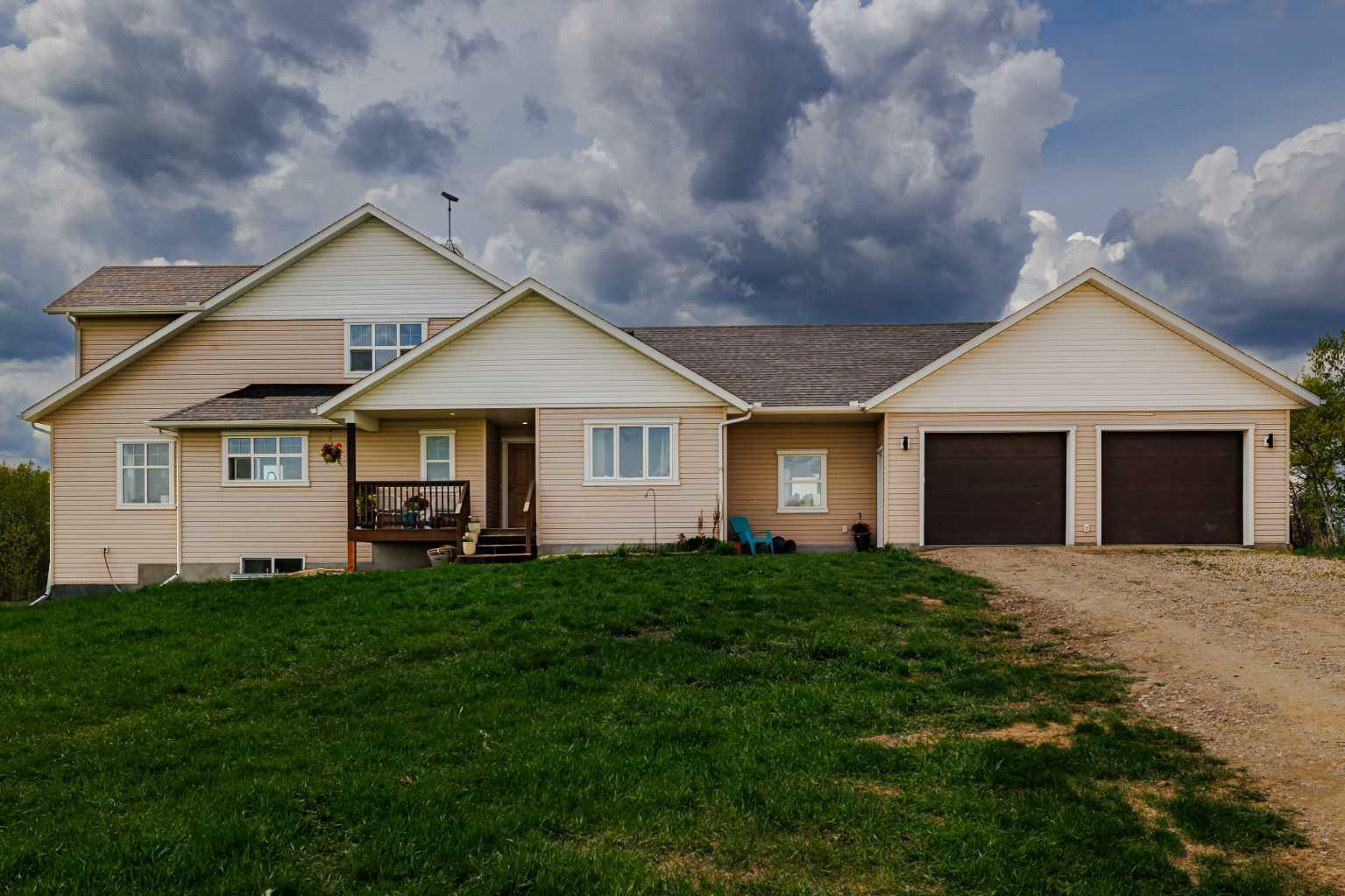 Property Photo: 274212 Lochend Road AB T4C 2Y2
