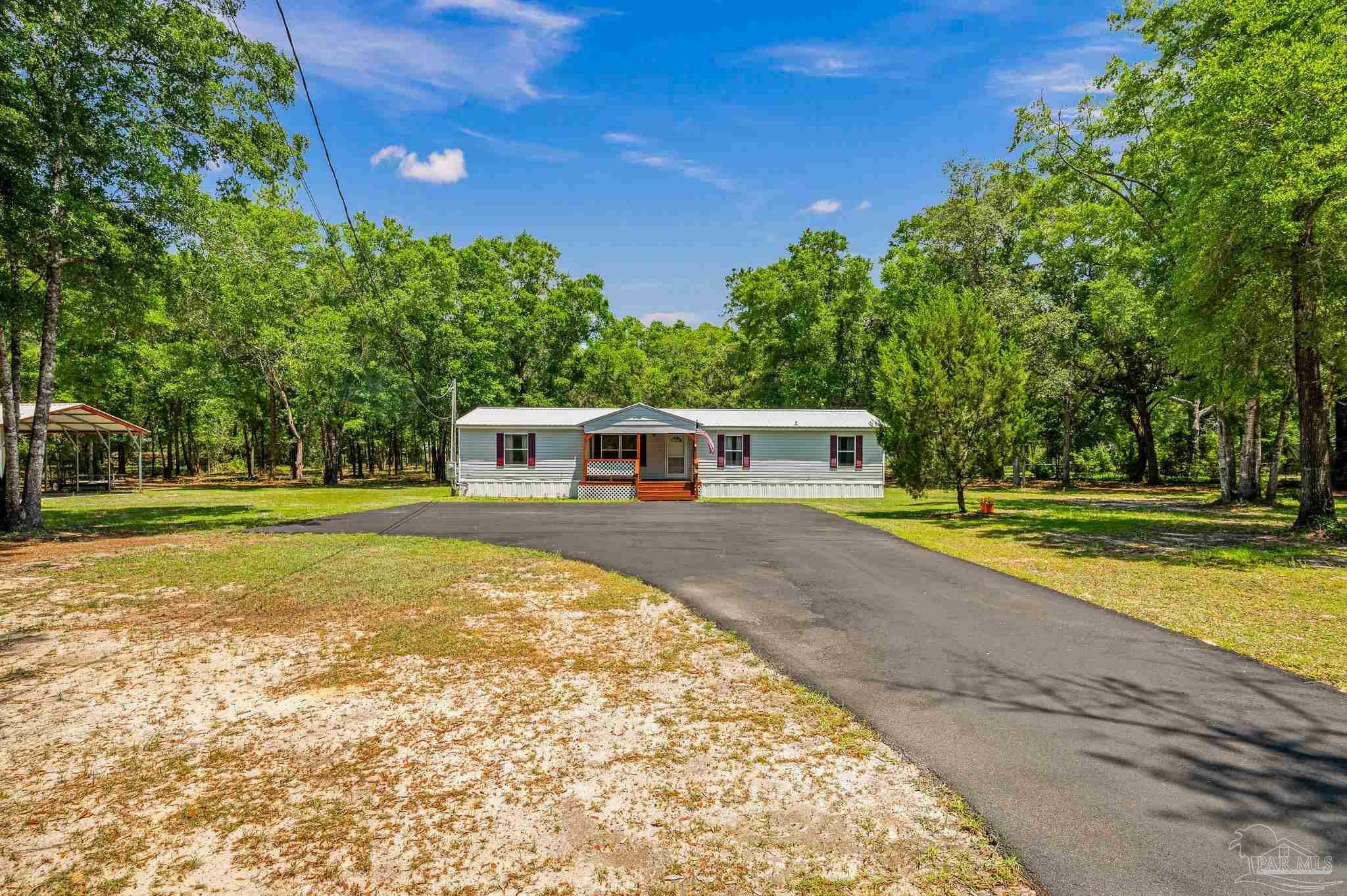 Property Photo:  8944 John Hamm Rd  FL 32583 