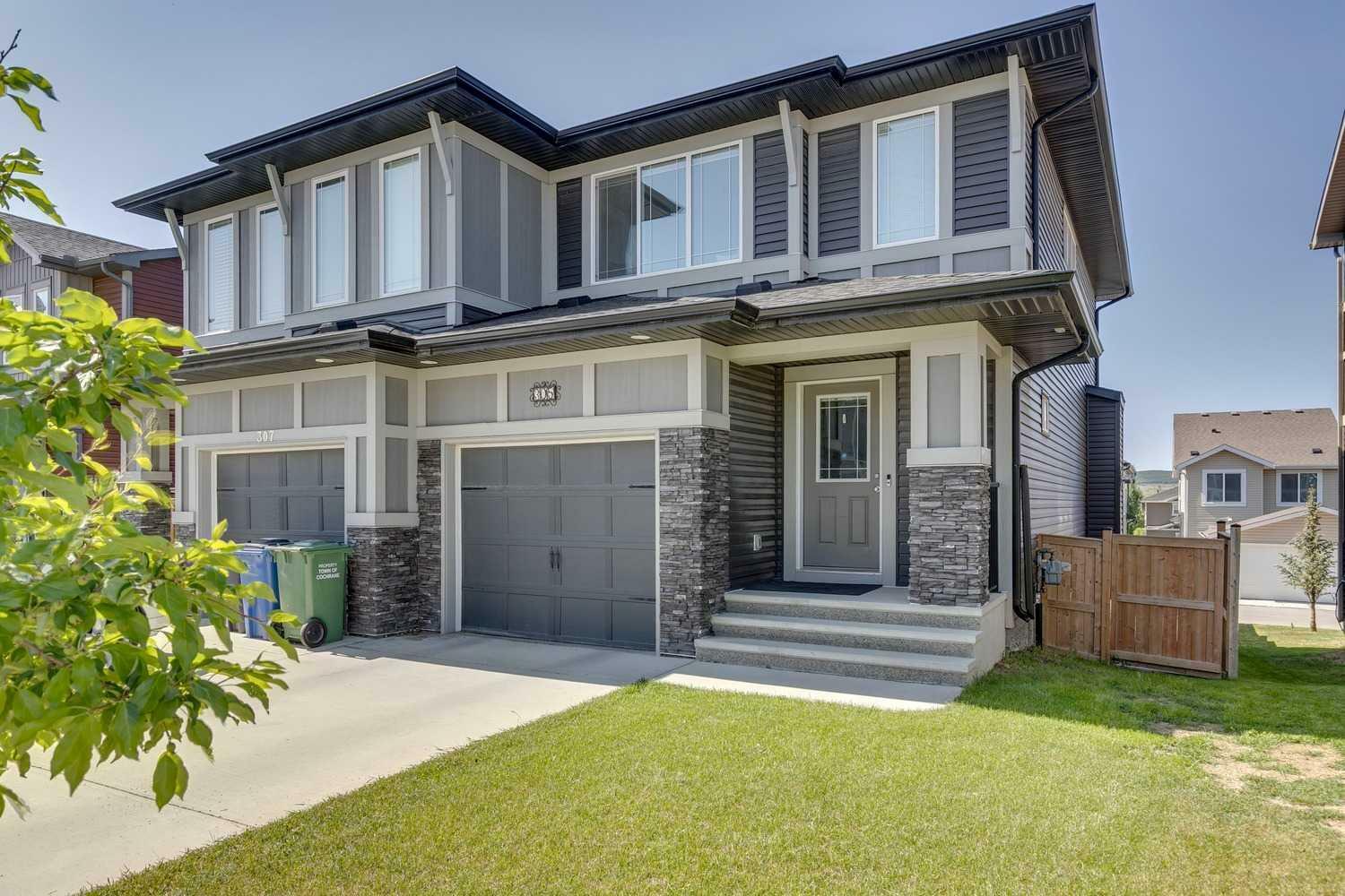 Property Photo: 305 Heartland Crescent AB T4C 2P7