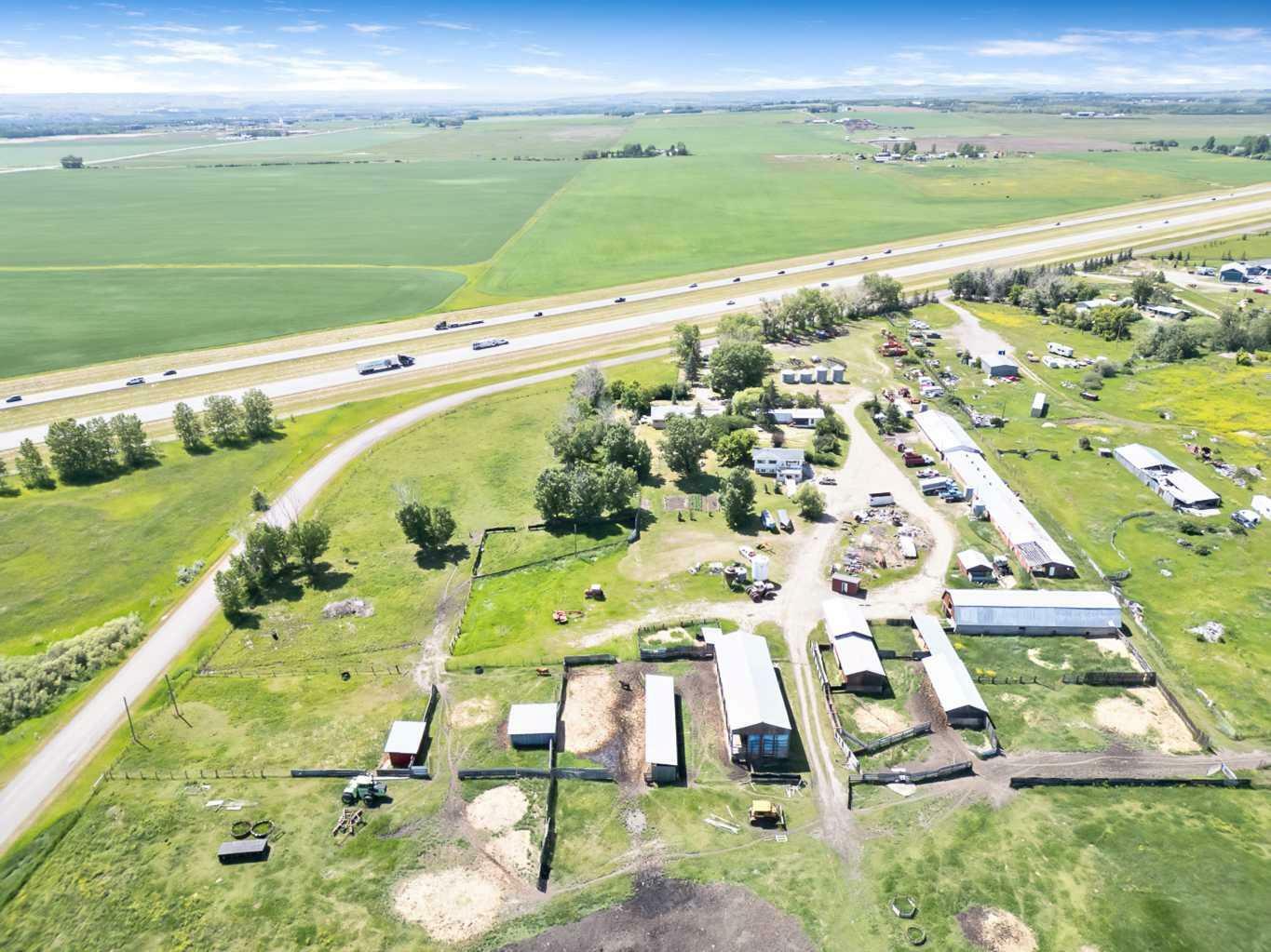 Property Photo: 322140 1048 Drive E AB T1S 4T1