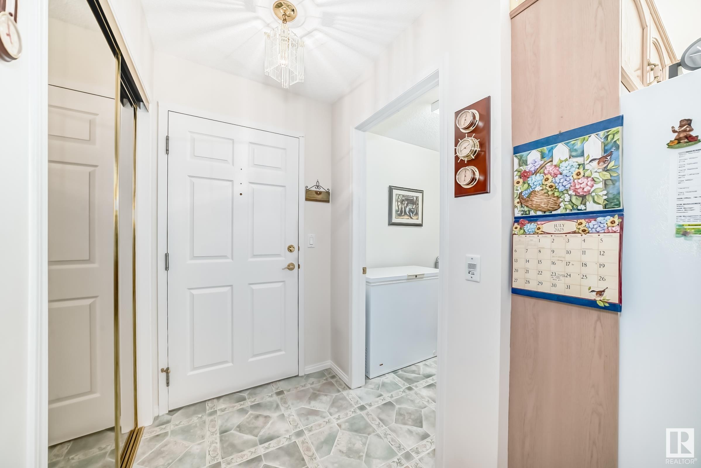 Property Photo:  10915 21 Avenue NW 211  AB T6J 6X2 