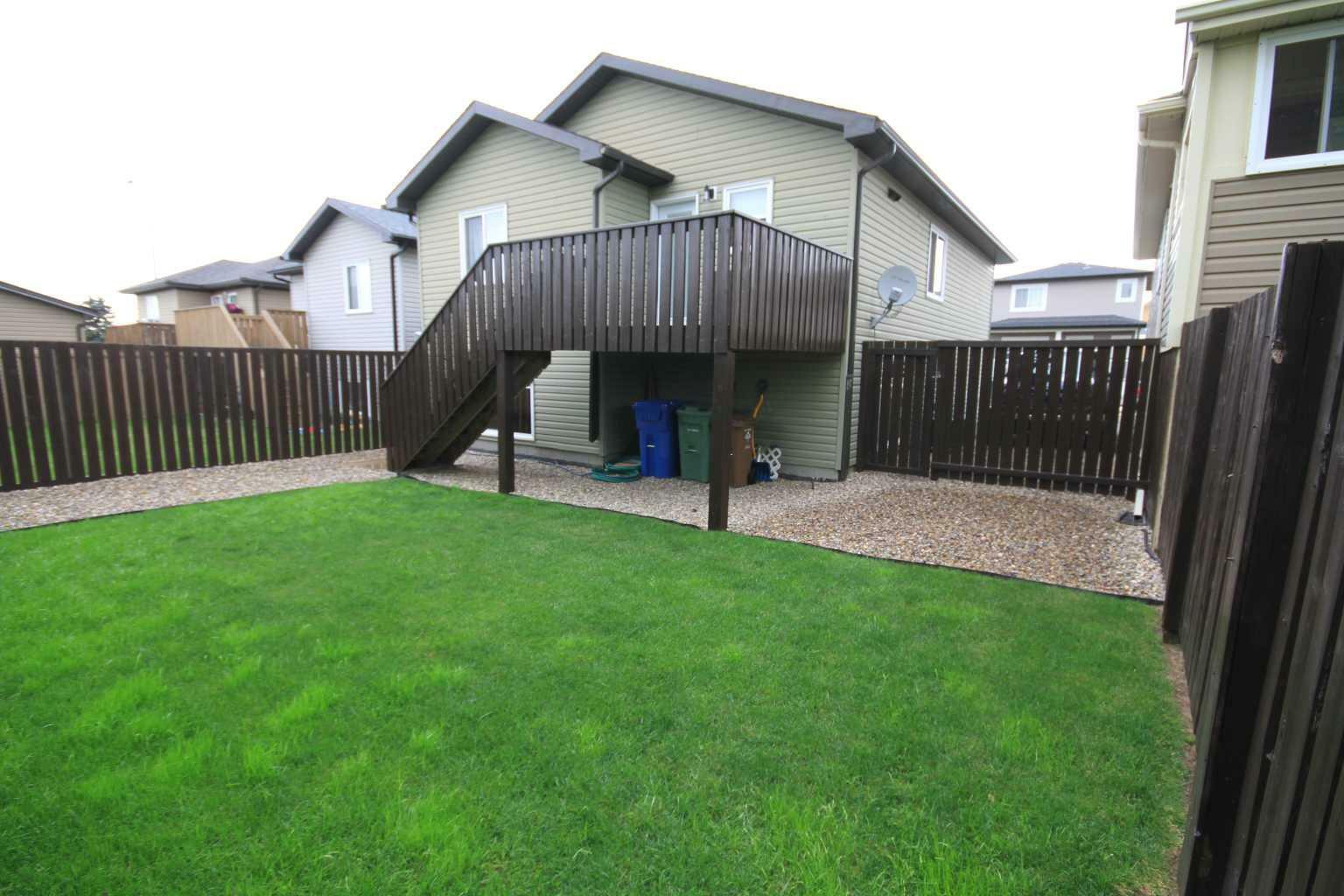 Property Photo: 5609 43 Street H AB T1G 0A8