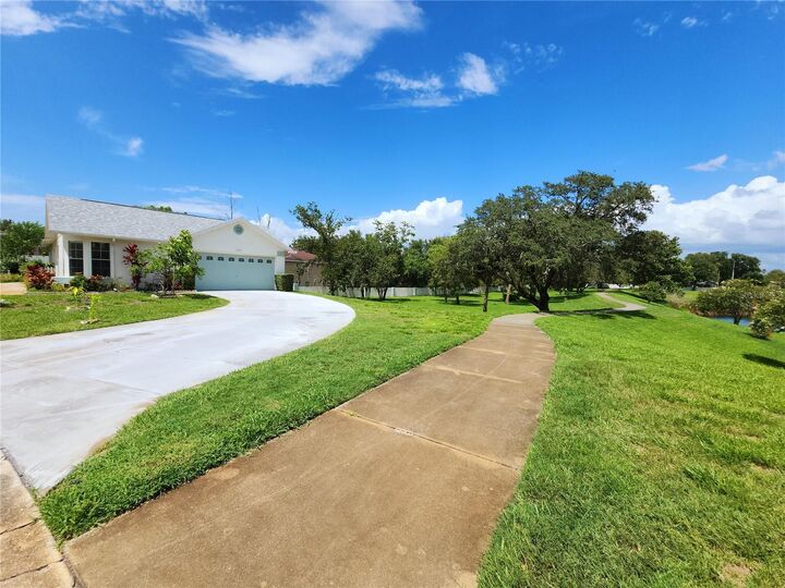 Property Photo: 11653 Orleans Lane FL 34668