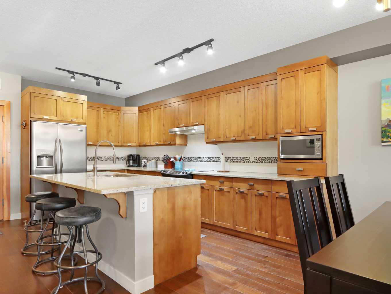 Property Photo:  106 Stewart Creek Landing 303  AB T1W 0G6 