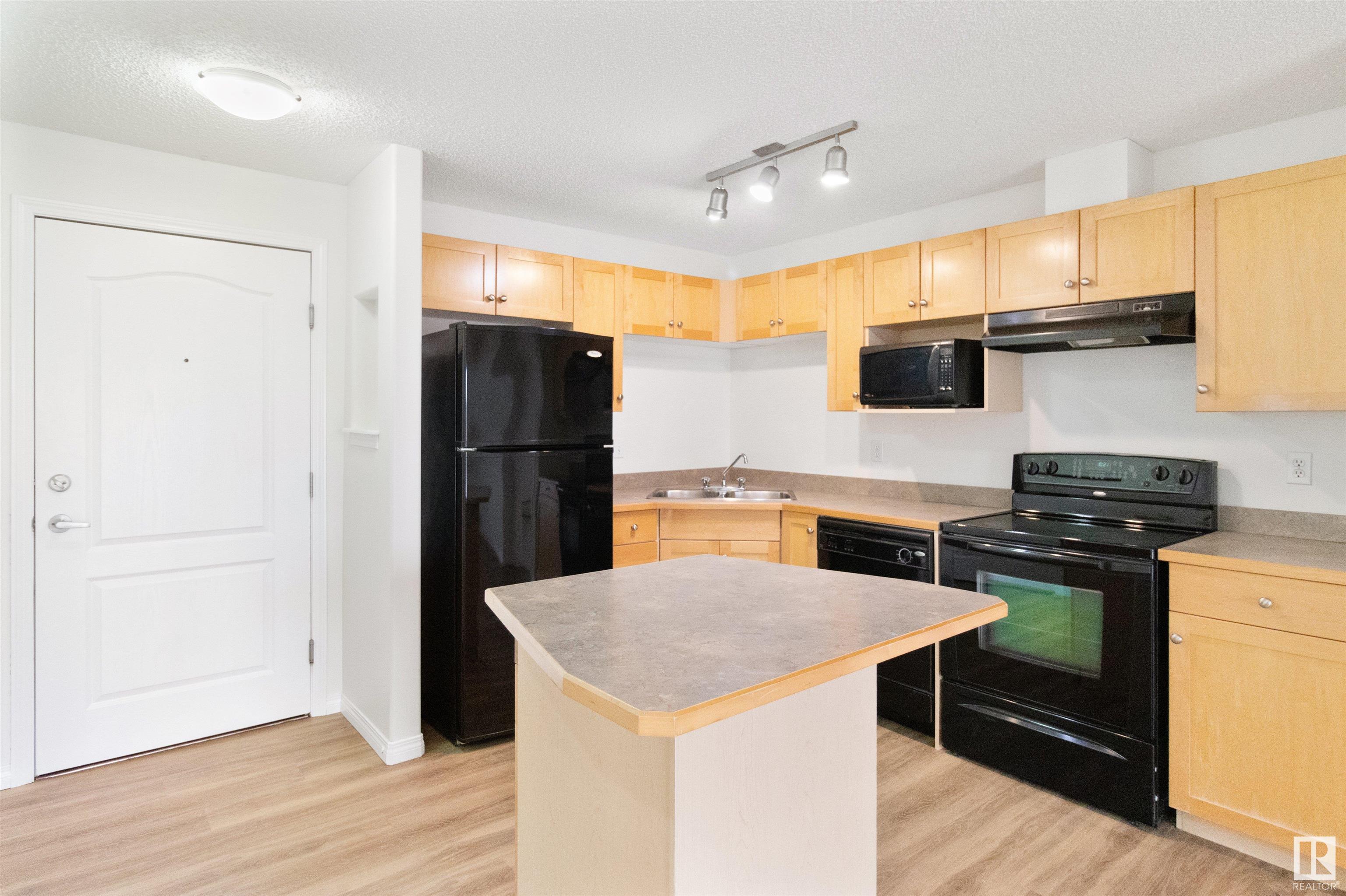 Property Photo:  155 Edwards Drive SW 218  AB T6X 1N6 