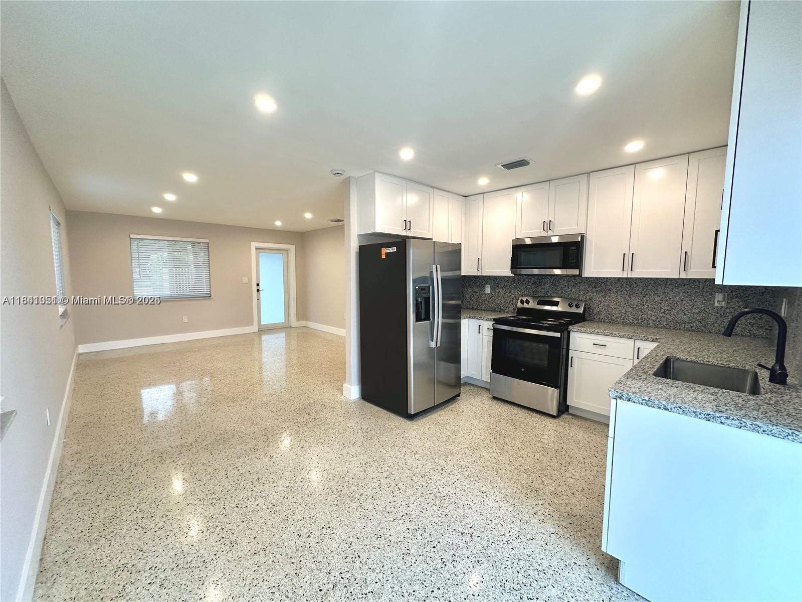 Property Photo:  10300 NW 35th Ct  FL 33147 