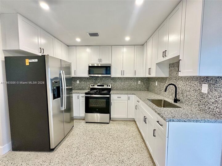 Property Photo:  10302 NW 35th Ct  FL 33147 