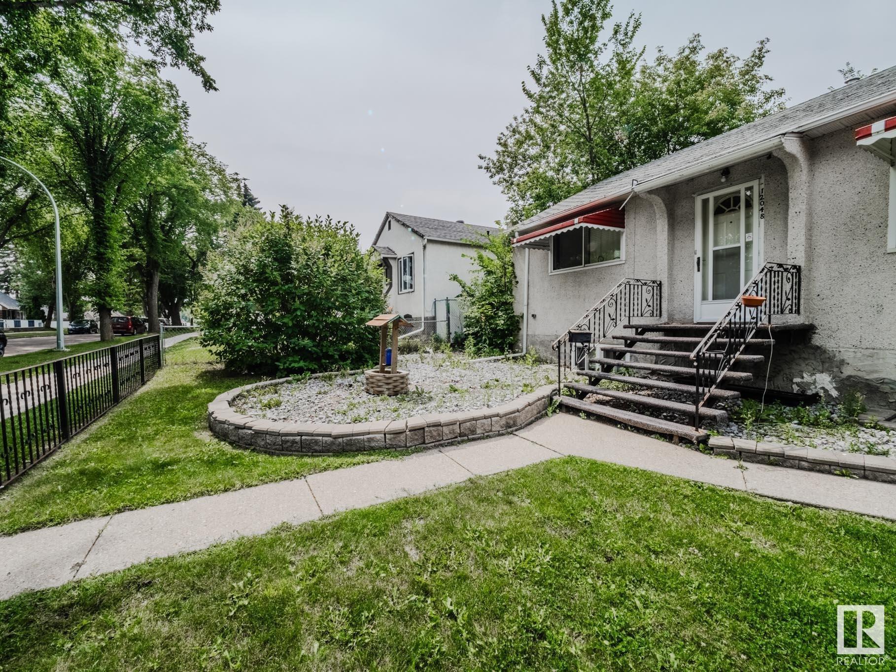 Property Photo:  12048 61 Street NW  AB T5W 4B1 