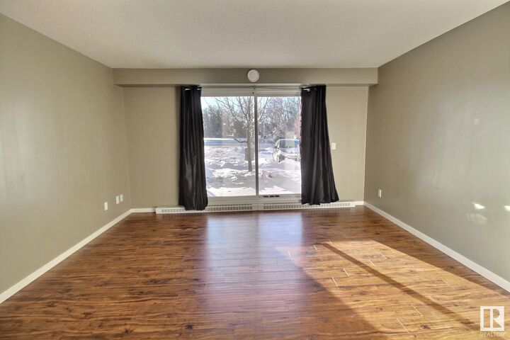Property Photo: 610 Calahoo Road 103 AB T7X 1R1
