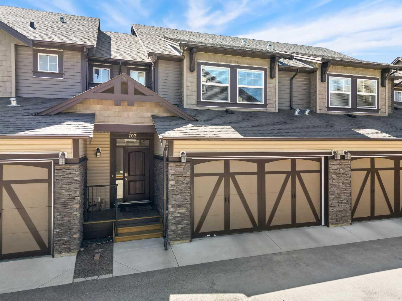 Property Photo: 110 Coopers Common SW 702 AB T4B 3Y3