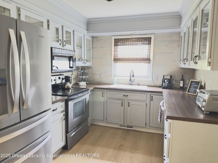 Property Photo:  5587 Wood Valley Drive  MI 48840 