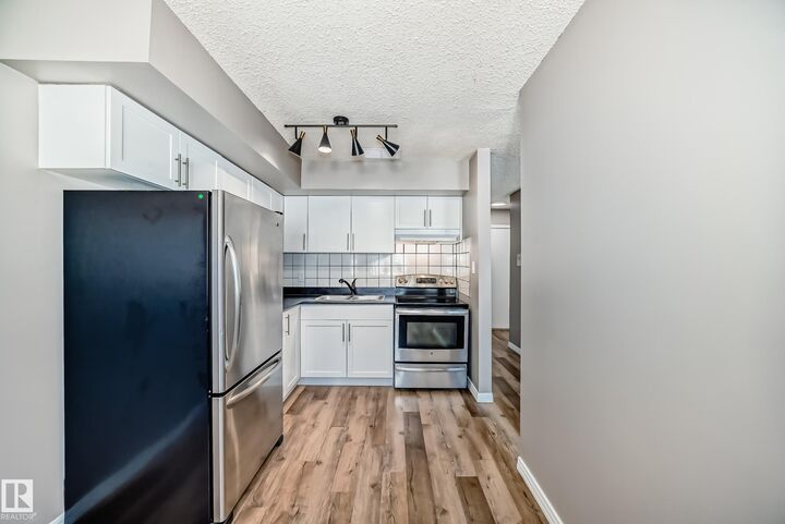 Property Photo:  16340 109 Street NW 112  AB T5X 2T4 