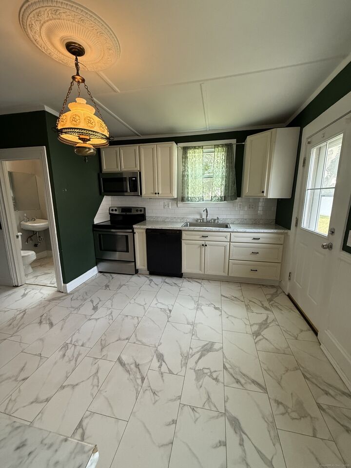 Property Photo: 65 Maple Street 67 CT 06040