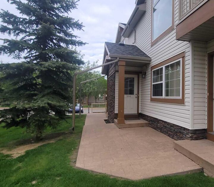 Property Photo: 80 Panatella Landing NW 206 AB T3K 0K8